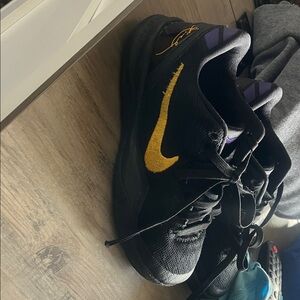 Nike Kobe’s Black and Yellow Athletic Shoes